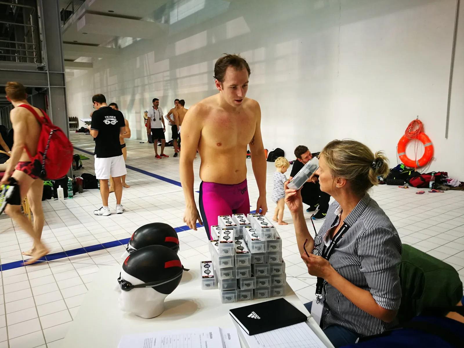 Poolside session recording swimmers and their equipment