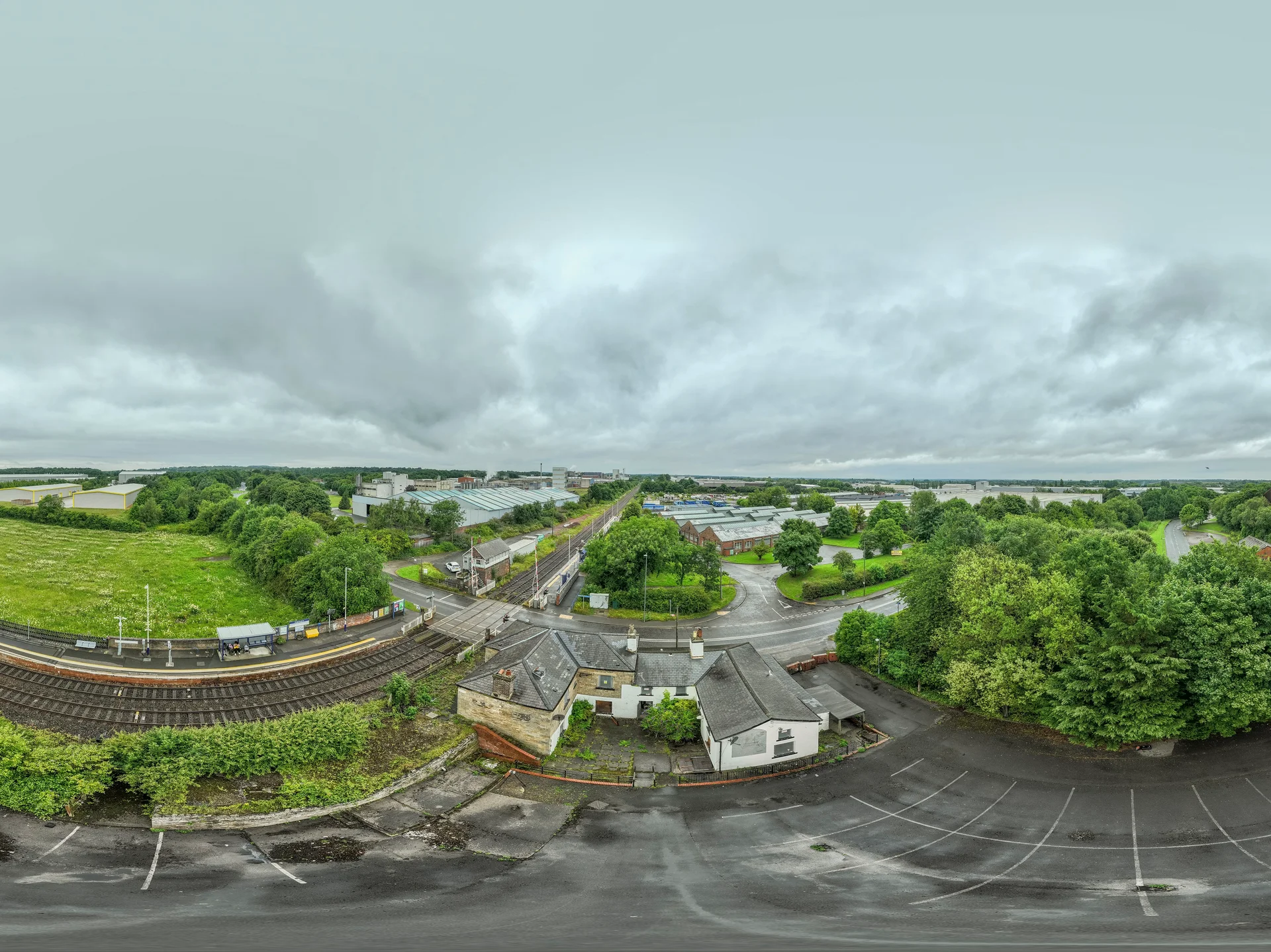 Aerial panorama of Heighington Station with the railway line running past it
