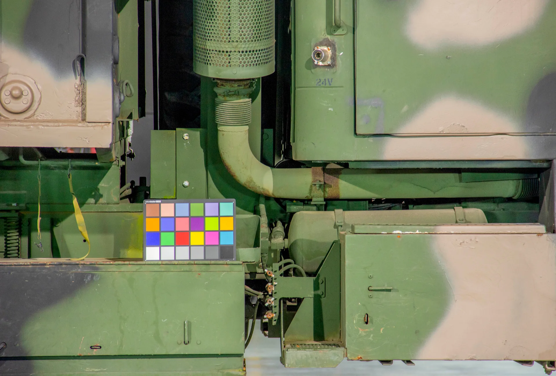 Macbeth colour reference chart placed against the army truck during the photogrammetry pass