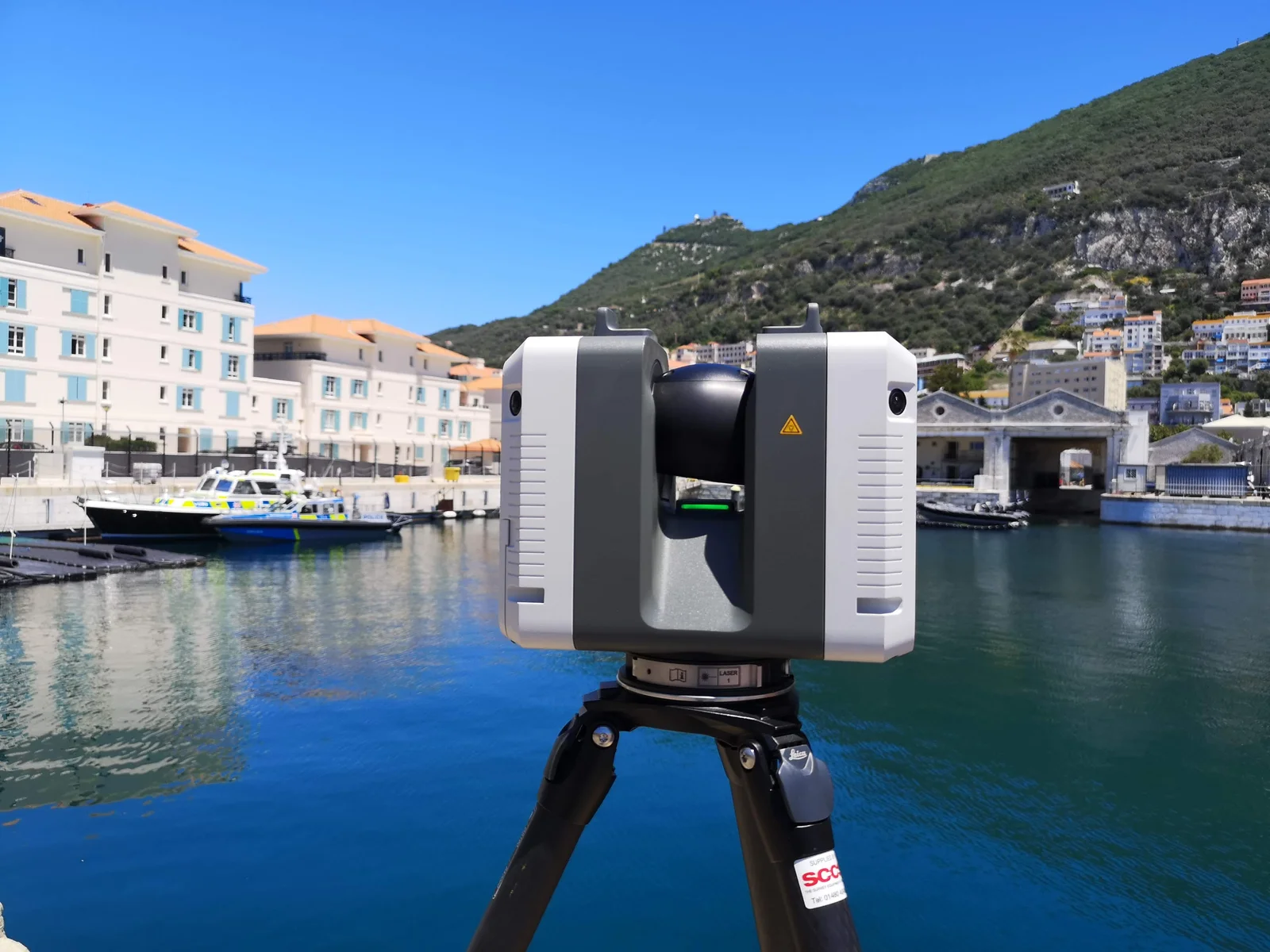 Laser scanner set up on the quayside at Gibraltar with the marina behind