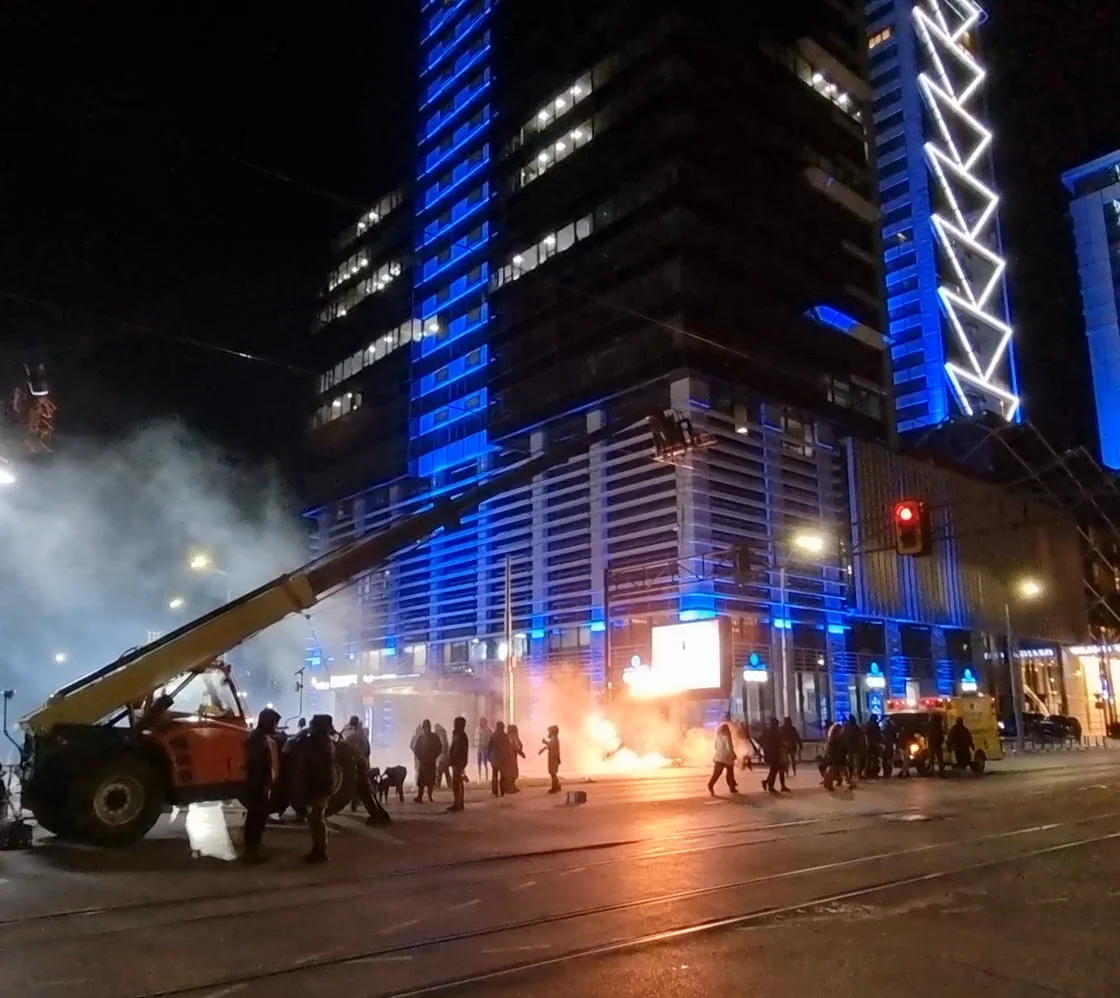 Night shoot on the city street with the crane rig and practical fire