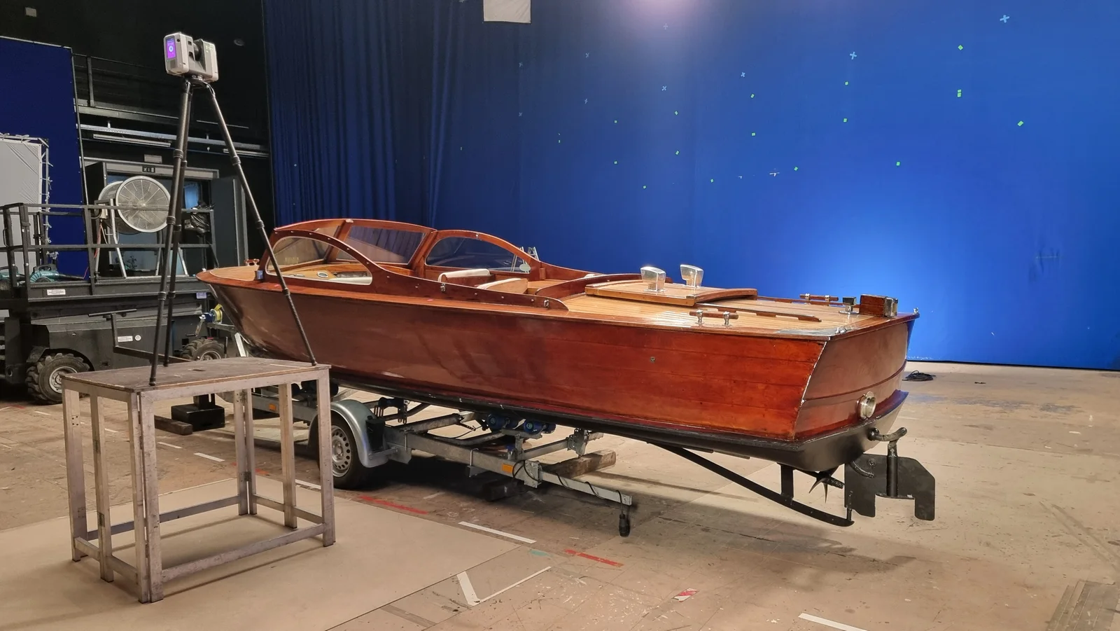 The Riva Aquarama on its trailer against the blue screen