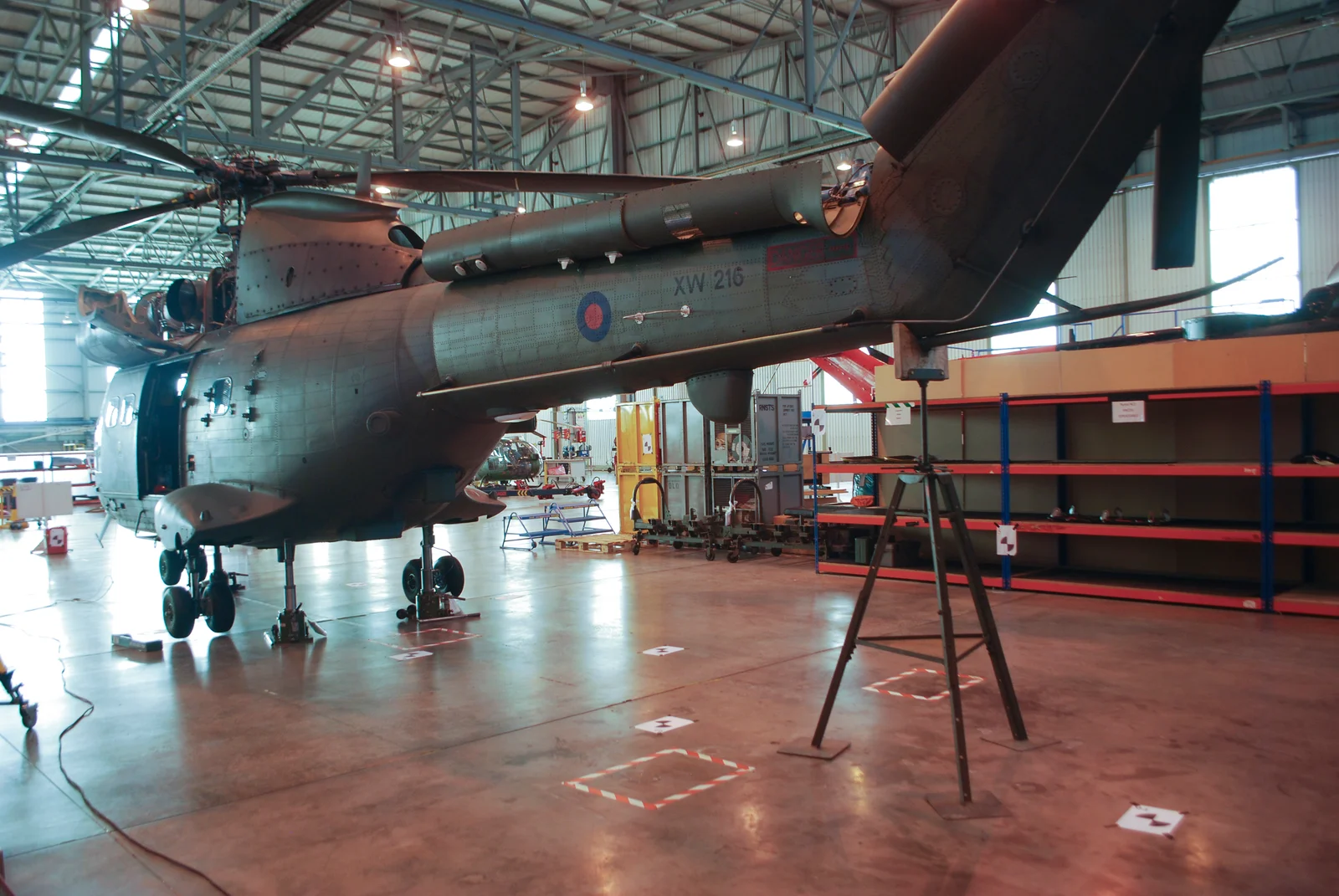 Side view of the aircraft across the hangar floor