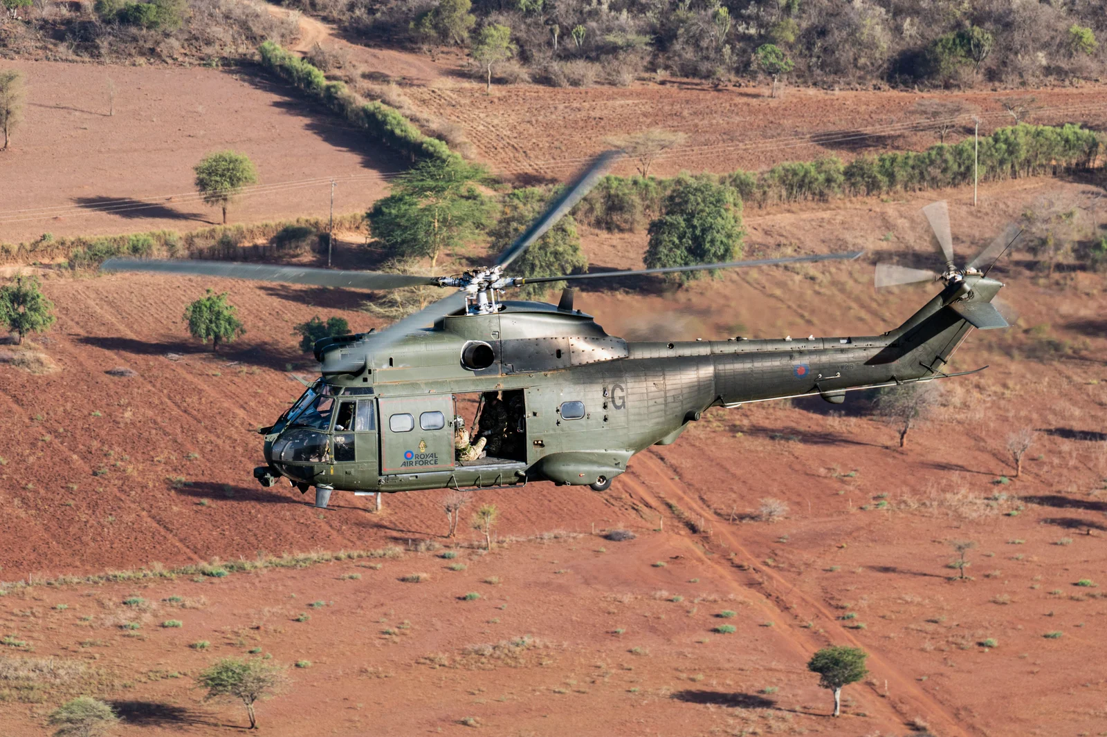 The Puma in service, landed on red earth