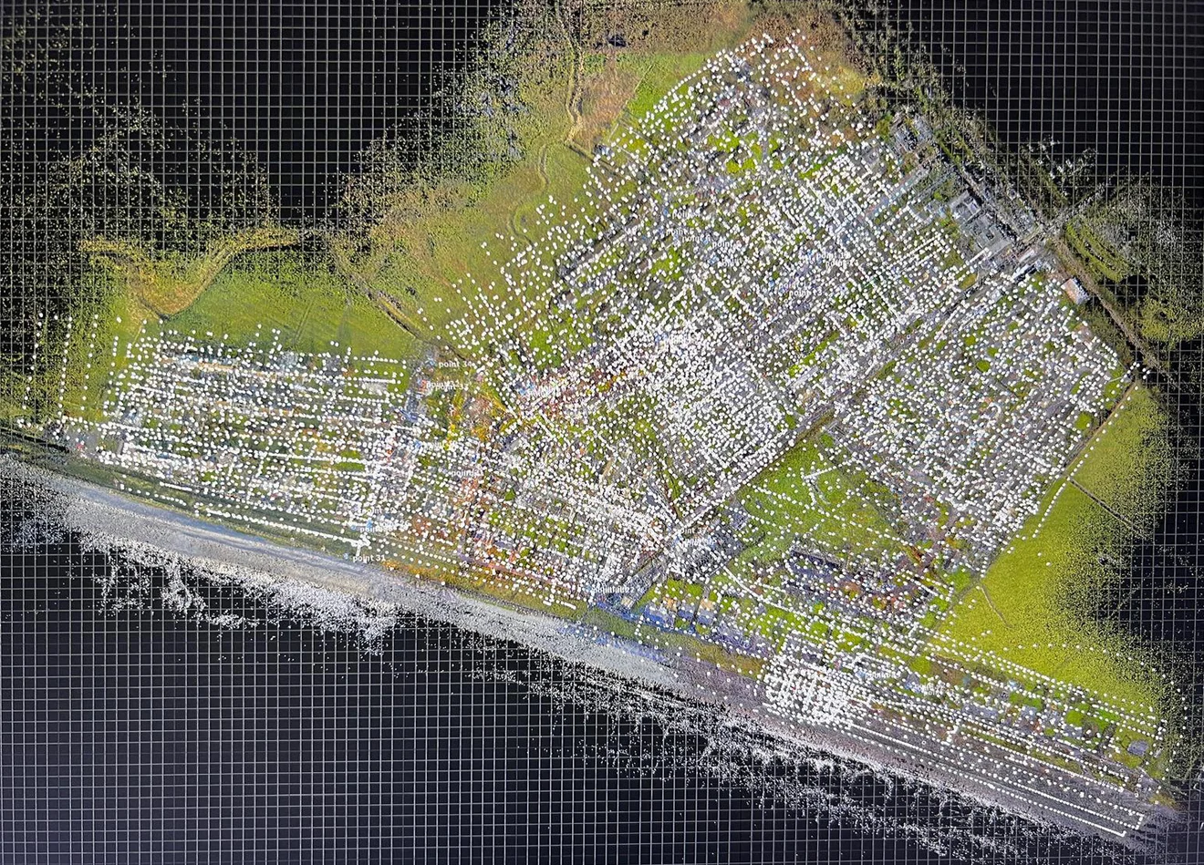 Dense aerial point cloud of Fairbourne with the individual camera positions plotted across the village