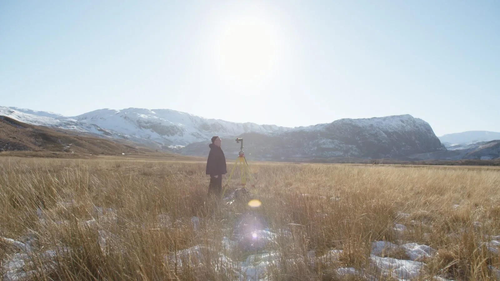 Kittiwake Digital surveyor with scanning equipment in dramatic mountain landscape
