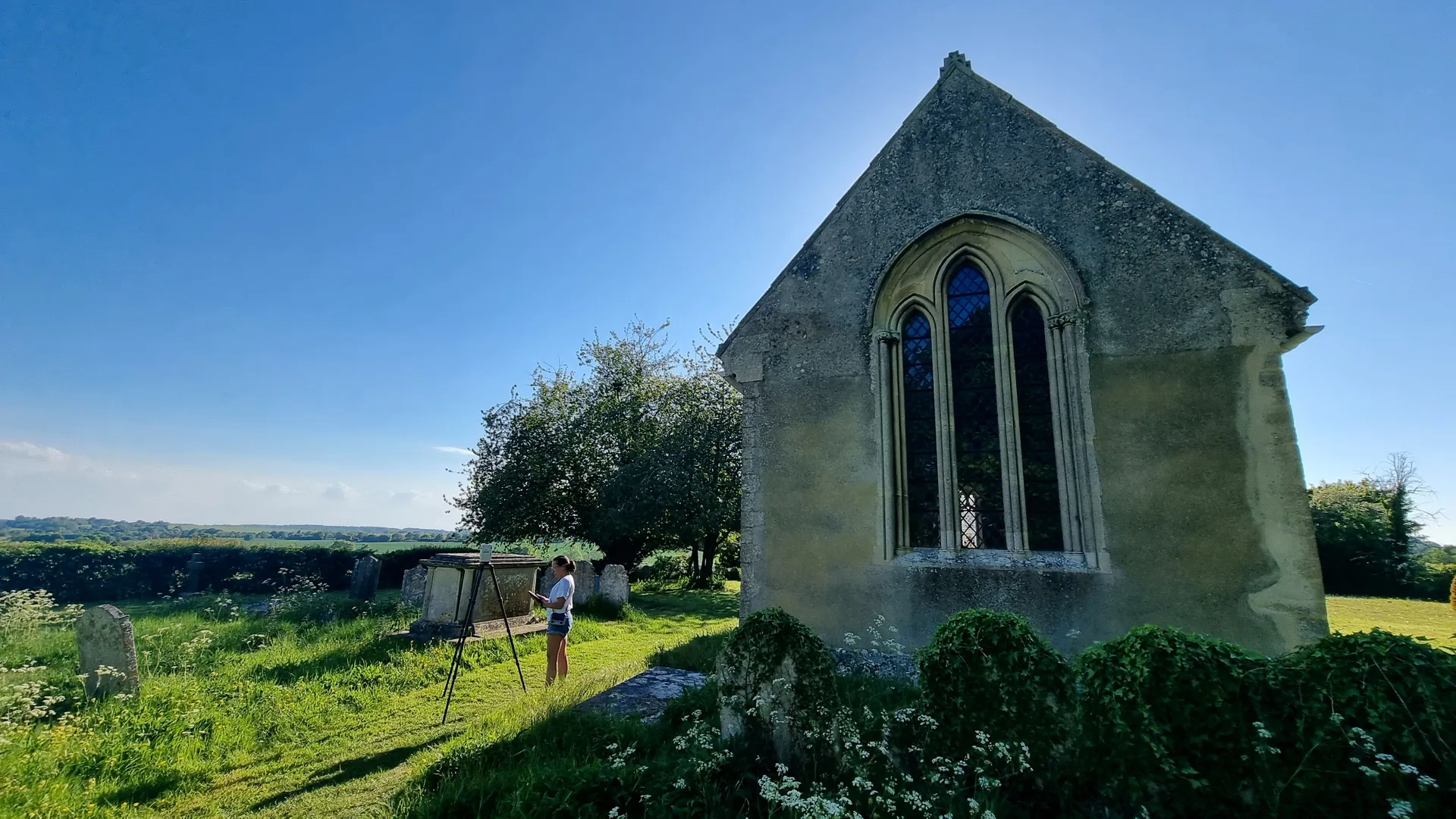 Jandira scanning a historic church in the English countryside