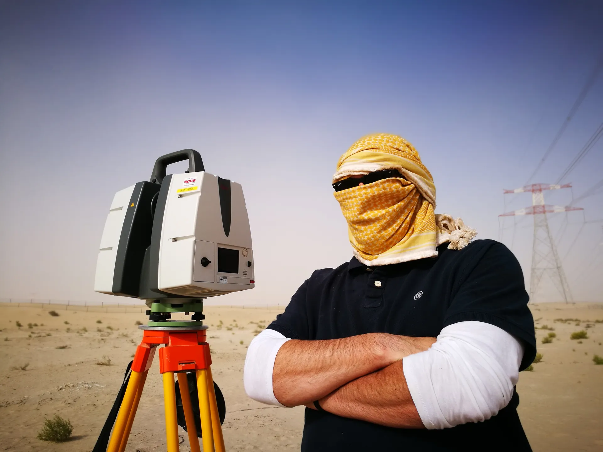 Duncan with LiDAR scanner in desert conditions
